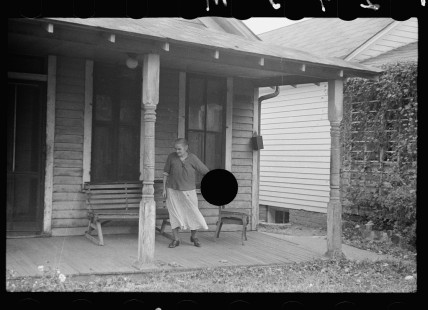 0499_Elderly occupier on her veranda