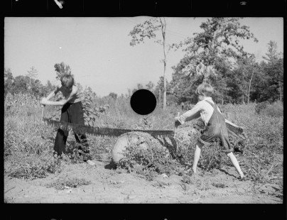 0569_Two young lads with a cross-cut saw