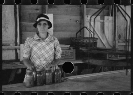 0607_Woman with Kilner jars, unknown location