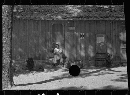 0613_Cook taking a rest outside Barracks' kitchen