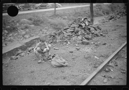 0709_Miner's son with bag of coal,