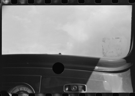 0721_ spoilt negative , loading the camera in a car, exposure through windscreen.