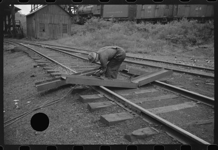 0745_Track worker cutting a steel section with a welding torch , unknown location