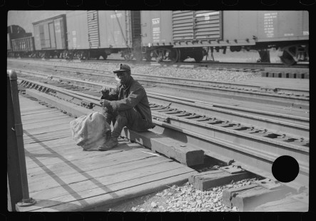 0830_Miner taking a rest on his way home,
