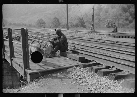 0832_Miner taking a rest on his way home, aftershift