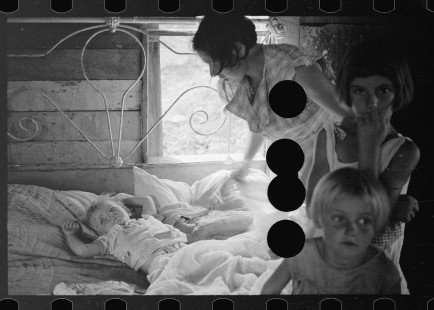 0007_Wife of sharecropper with sick child