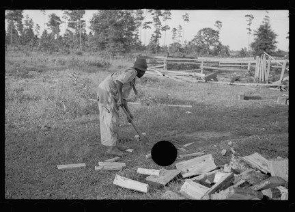 0058_African-American boy chopping wood